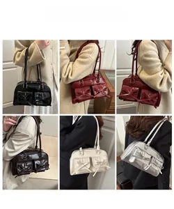 Detail shot of vintage high-shine PU leather shoulder bags in five trendy colors with bows