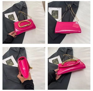 Macro shot of glossy fuchsia patent leather handbag with gold oval metal buckle and chain