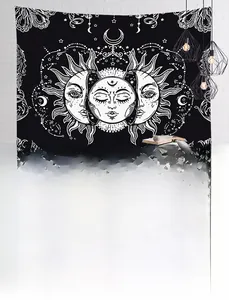 Detail of Nordic sun and moon tapestry hanging on a textured white brick wall in a bedroom