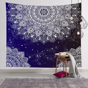 Nordic mandala tapestry with starry night background hanging on a white brick wall