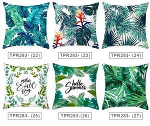 Detail of tropical plant pillow covers with high-definition monstera and palm leaf patterns