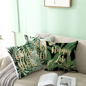Nordic green tropical plant pillow covers set with leaf prints and inspiring quotes on sofa