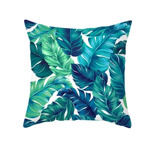 Nordic square pillow cover featuring tropical green palm leaf prints on white background