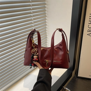 Large burgundy oil leather tote bag for women with cute cow charm and front zipper