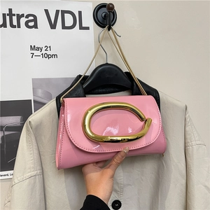 Pink patent leather clutch bag with gold C-logo metal clasp and chain shoulder strap