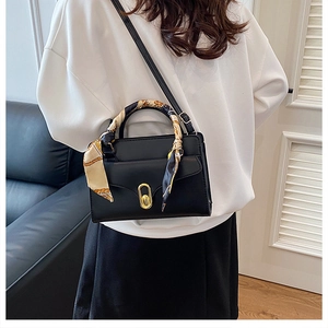 Fashionable black square handbag with silk scarf handle and golden lock for women