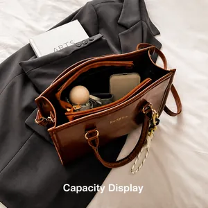 Brown PU leather tote bag with large capacity showing umbrella and phone storage