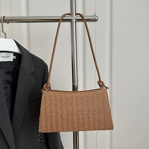 Chic brown woven underarm bag with unique knot shoulder strap and herringbone texture