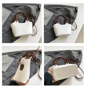 Detailed four-view shot of cream bucket bag with brown handles and fashion lettering