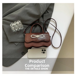 Brown crocodile texture small handbag with rhinestone bow and phone for size comparison