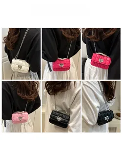 Detailed view of quilted mini square bag with pearl handle and metal chain in five colors