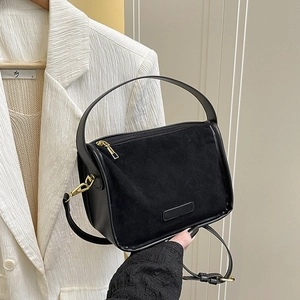 Matte suede black tote bag with top handle and gold zipper for stylish women
