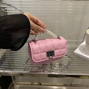 Pink quilted PU leather mini bag with white pearl handle and silver chain strap