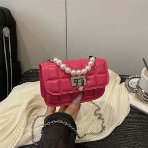 Magenta quilted crossbody bag with luxury faux pearl handle and silver chain strap