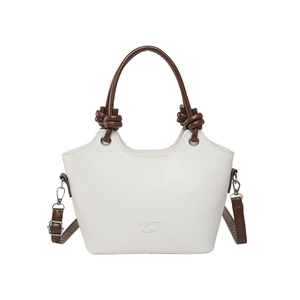 Vintage style cream and brown bucket bag with twisted handles and crossbody strap