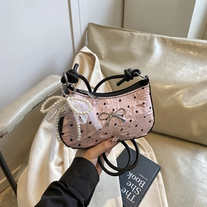 Pink bow handbag with black heart print and decorative pearl lace pendant accessory