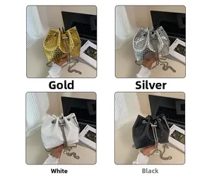 Detail of woven bucket bags in gold, silver, white, and black with metal chains