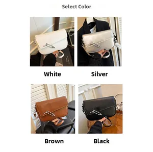 Detail view of four semi-moon saddle bags in white, silver, brown and black colors