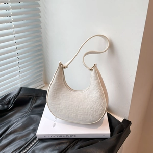 Minimalist cream white pebbled leather hobo bag with adjustable strap for women
