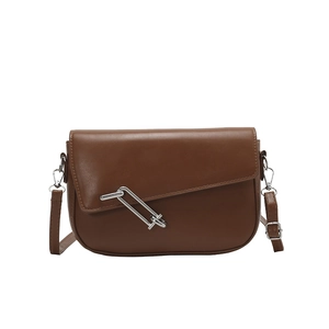 Brown semi-circle leather shoulder bag with unique silver pin metal buckle on white background