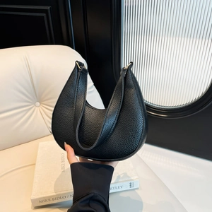 Minimalist black crescent moon bag with lychee texture pattern and metal buckle