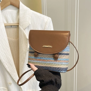 Straw rainbow woven bucket bag with brown leather flap and stylish crossbody strap