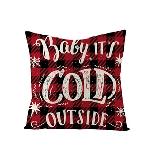 Red and black buffalo plaid Christmas pillow cover with white festive text and snowflakes
