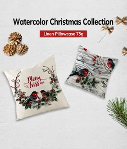 Detalle de fundas de cojín navideñas de lino con estampados de pájaros y coronas acuarela