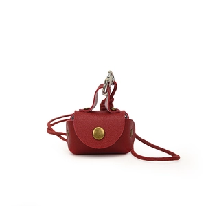 Mini red leather pouch necklace with litchi texture and gold snap button for storage