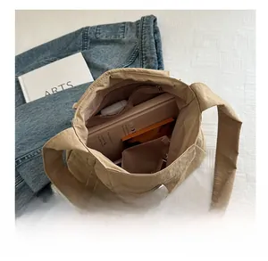 Interior view showing the large storage capacity and zipper pockets of this casual tote