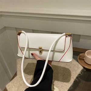 Minimalist white baguette bag with red piping and gold swivel lock for women