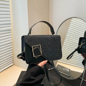 Minimalist black leather handbag with sequin flap and gold square buckles for urban fashion