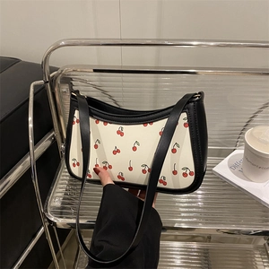 Trendy black and white cherry print baguette bag with chain strap and zipper closure