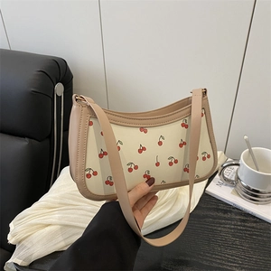Chic cream underarm bag with red cherry prints and chain strap for summer 2025