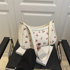 White faux leather underarm bag featuring sweet cherry prints and a stylish leather strap