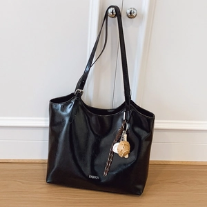 Large black glossy leather tote bag with sports charms and fashion print for daily commute