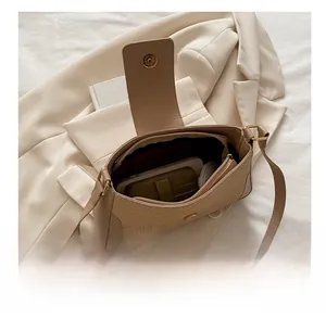 Top view of woven beige hobo bag interior with zip pocket and ample storage space