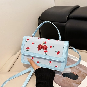 Light blue faux leather handbag with 3D crystal cherry decor and cherry pattern print