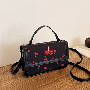 Chic black canvas crossbody bag with red cherry prints and 3D cherry accent for women