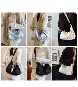 Three stylish hobo bags in silver, beige, and black displayed on fashion models