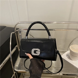 French style black glossy leather crossbody bag with a sparkling G-letter metal clasp
