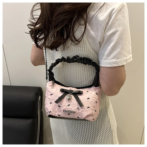 Pink pleated crossbody bag with black bows and fashion metal heart pendant detail