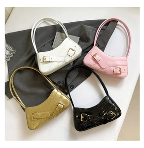 Crocodile pattern underarm bags in white, pink, gold, and black with metal buckles