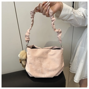 Pink shoulder bag with cute bear print, ruffled cloud strap and plush charm detail