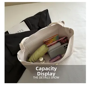 Top-down view of a cream tote bag showing spacious interior with daily essentials