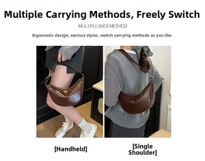 Detail of dark brown croissant shoulder bag with glossy finish and adjustable strap