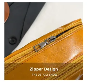 Detail showing the smooth metal zipper design and lychee texture on the yellow shell bag