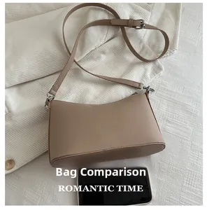 Compact beige leather shoulder bag shown next to a smartphone for size comparison