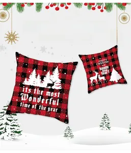 Macro detail of red buffalo plaid Christmas pillowcase featuring reindeer and tree prints