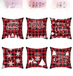Close-up of red and black buffalo plaid Christmas pillow covers with festive prints